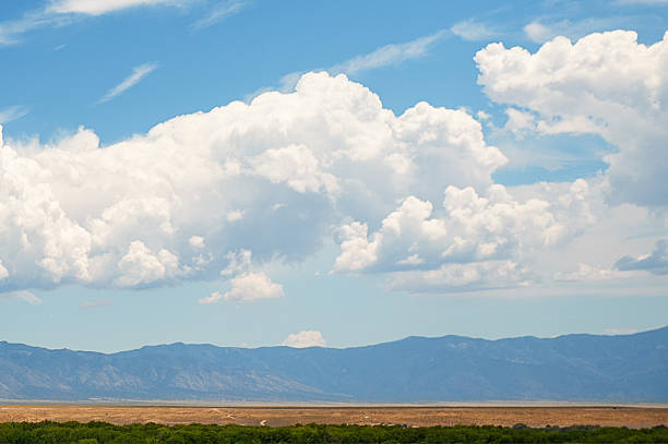 istock Sandia Mountains with Blue Sky and Clouds 585486154