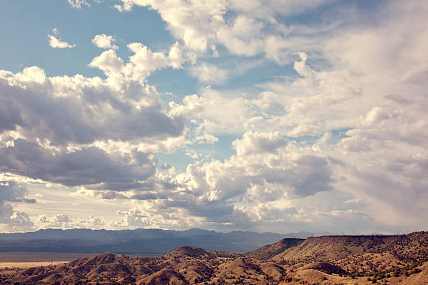 istock Sandia Mountains with Blue Sky and Clouds 585486550