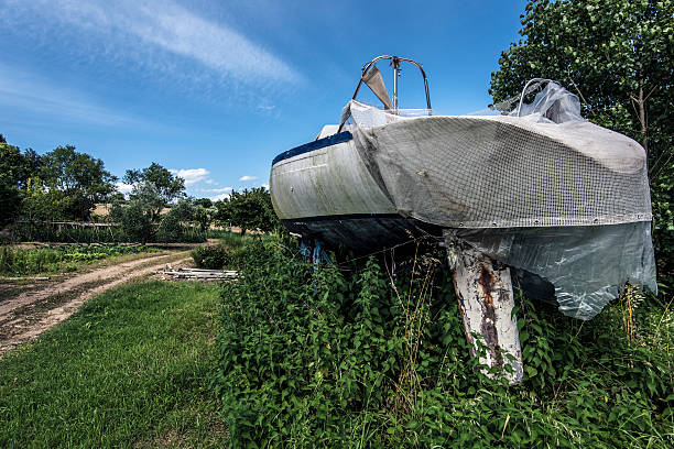 istock small white boat in a countryside garden 585487222