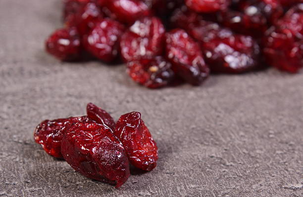 istock Heap of cranberries on structure of concrete 585487450