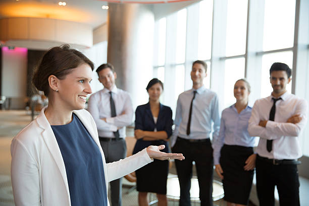 istock Happy Female Executive Manager with Team 585489154