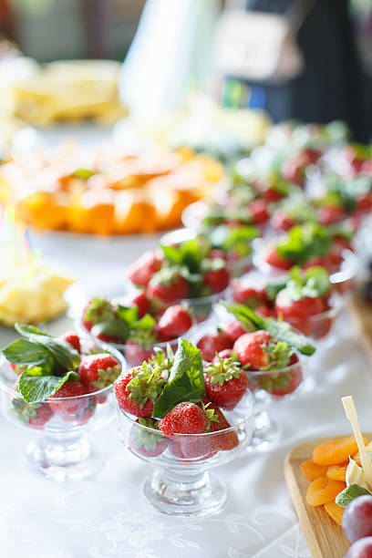 istock Strawberries in a glass bowl on the white table 585490456