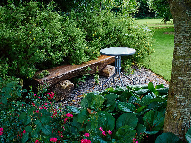 Beautiful wooden bench in a garden stock photo