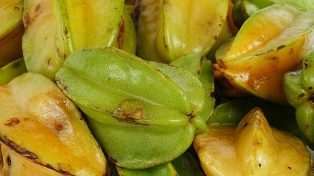 istock Bunch of Star Fruit in Natural Conditions 585491784