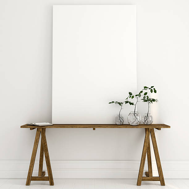 istock Mock up of a white canvas on a wooden table 585493718