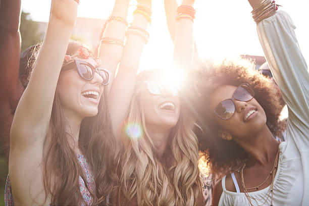 Friends dancing among bright sunbeams