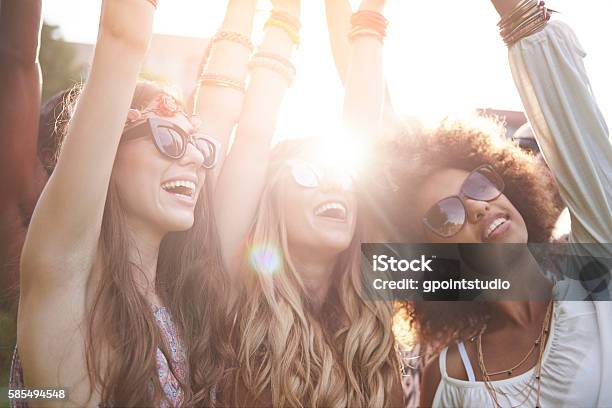 Friends Dancing Among Bright Sunbeams Stock Photo - Download Image Now - Music Festival, Party - Social Event, Fun