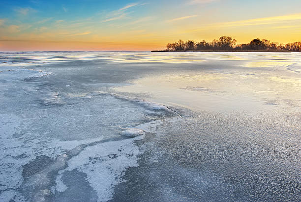 istock Winter ice frozen river landscape. 585495934