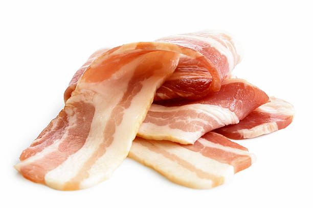 pile of streaky uncooked bacon isolated on white. - breakfast close up studio shot group of objects imagens e fotografias de stock