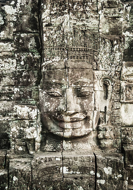 istock Ancient Faces of Bayon Temple, Angkor Thom, Angkor Wat, Cambodia 585500428