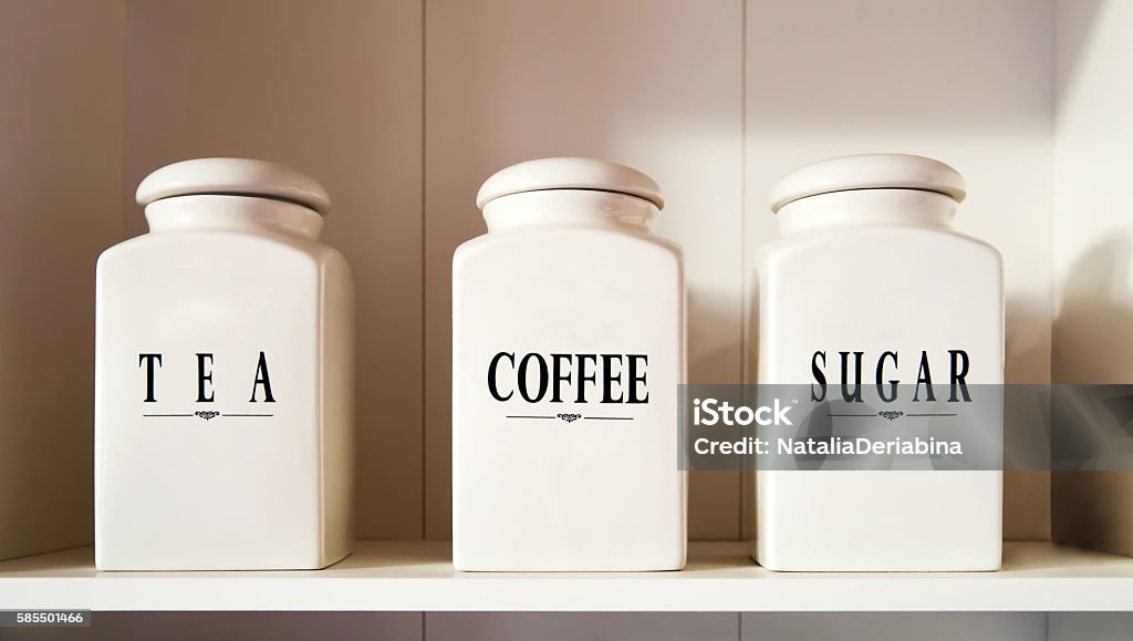 Modern tea coffee and sugar bowl in pantry shelf Jar Stock Photo