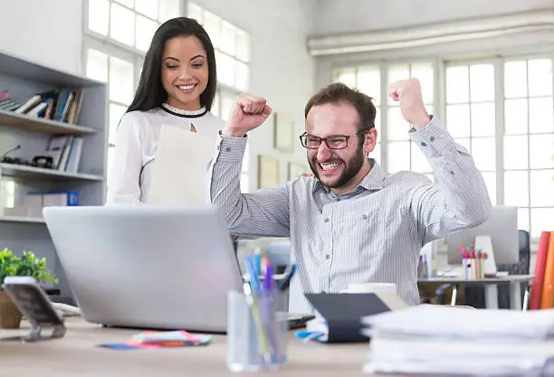 Photo of Excited young man at the work