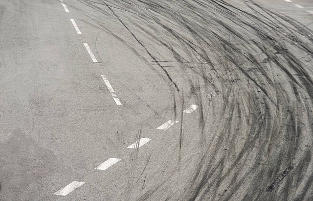 istock Tyre burnout marks on asphalt road 585502098