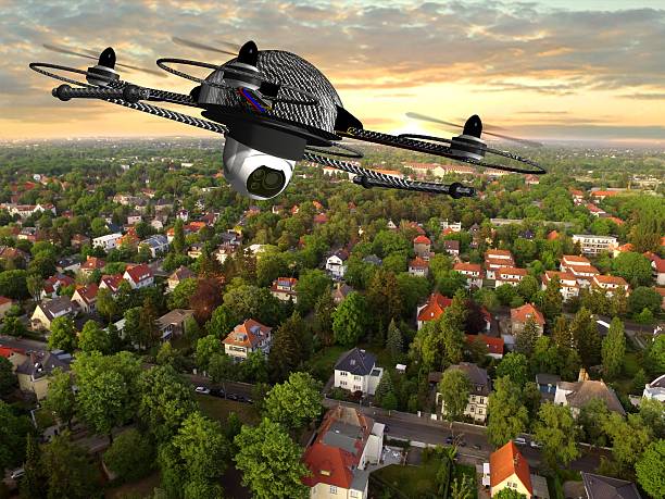 drone quadrocopter with camera in flight over over suburban Houses stock photo
