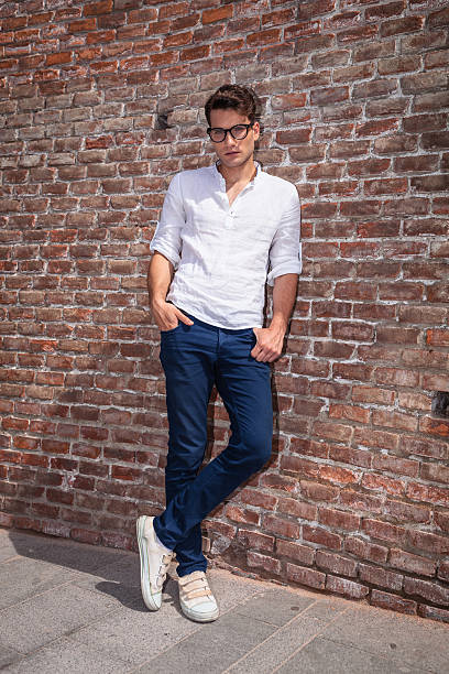 istock Attractive young man posnig with his hands in pockets 585504990