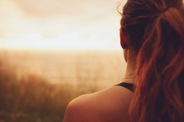 Woman looking at sunset