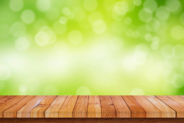 istock Wood floor with nature bokeh background 585505820