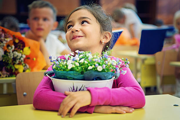 Little girl is happy at her first day at school.