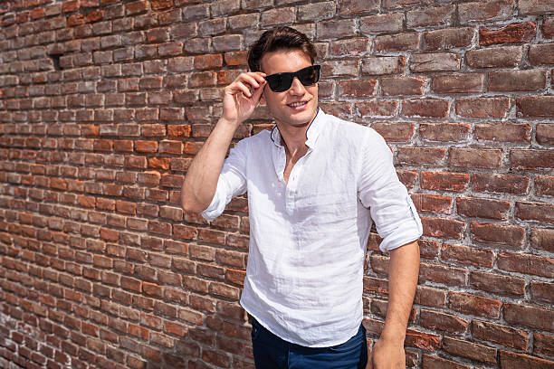 istock Smiling young fashion man looking away 585506306