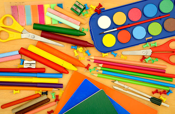 istock School supplies on desk from above. Copy Space. 585506610