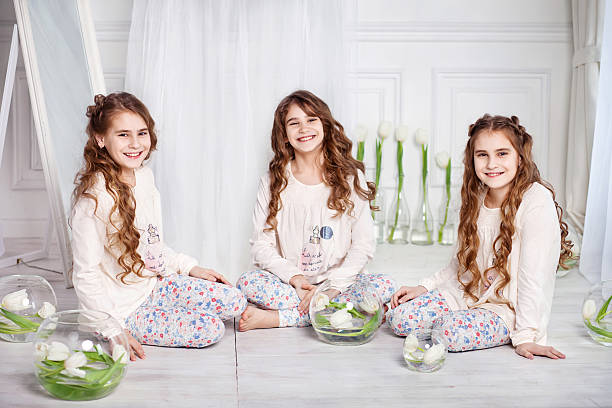 Portrait of three young charming sisters