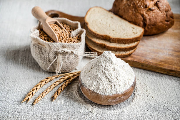 Wheat and flour on the table stock photo