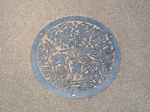 Manhole in Tokyo's Hibiya Park with \