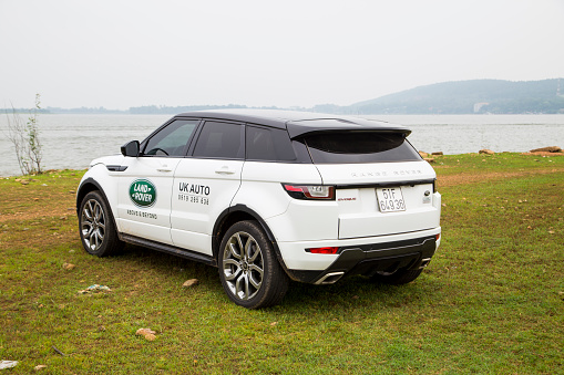 Hanoi, Vietnam - July 13, 2016: Range Rover (Land Rover) Evoque 2016 car on the test road in mountain area in Vietnam.