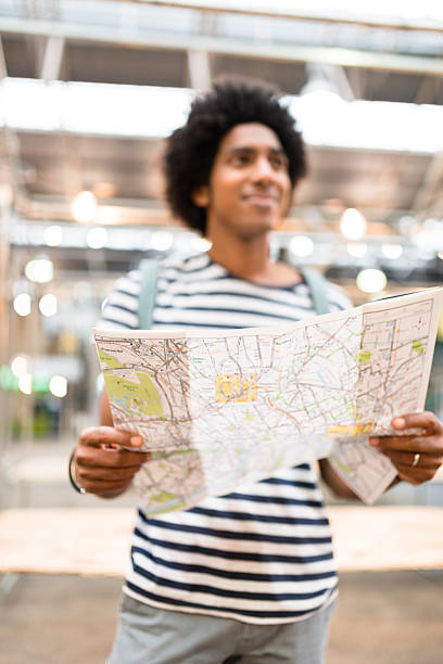 istock solo traveler in londonspitafields market reading a map 585510234