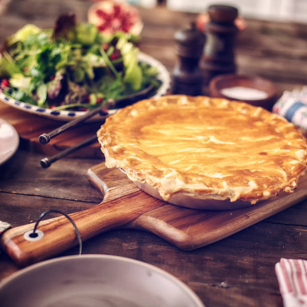 Delicious Homemade Chicken Meat Pie Homemade chicken meat pie with carrots, onion, mushrooms and celery. meat pie stock pictures, royalty-free photos & images