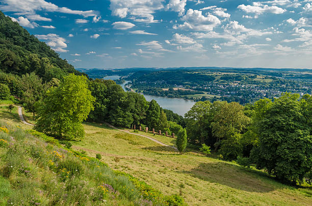 istock germany summer country landscape with meadow, forest and a sky 585511170