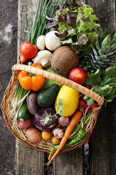different vegetables in big basket. top view stock photo