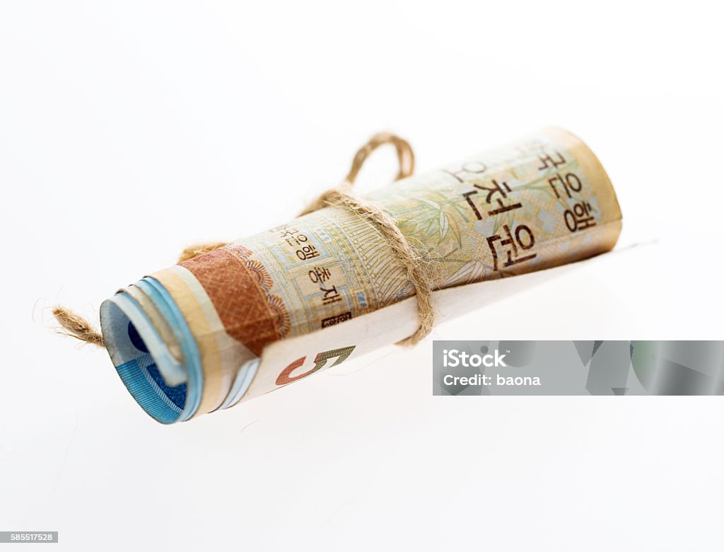 South Korea currency rolled Roll of South Korea currency isolated on white background. Banking Stock Photo