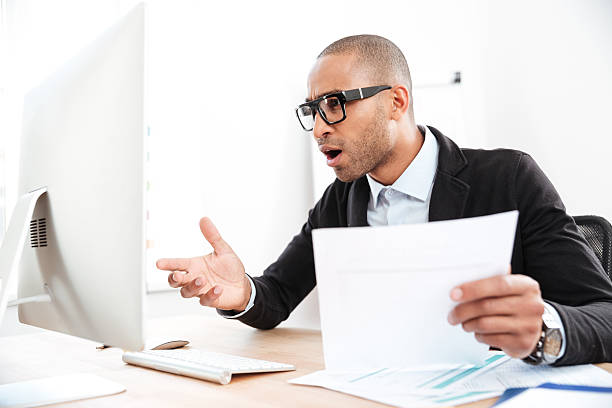 istock Businessman using a laptop and looking shocked 585519188