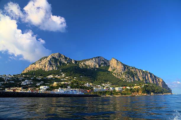 Capri is a small island located in the Tyrrhenian Sea off the Sorrentine Peninsula, on the South side of the Gulf of Naples.  The mountain on the island is Solaro.