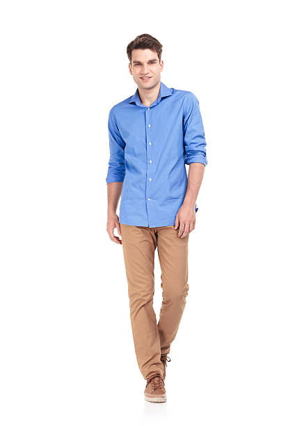 istock Smiling young fashion man walking 585521258