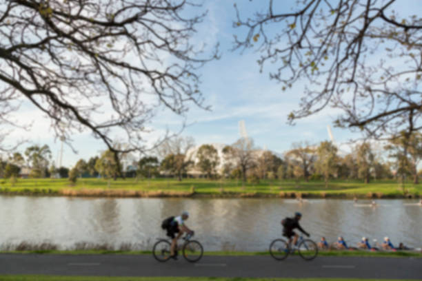 istock cyclist in the park, blurry 585521780
