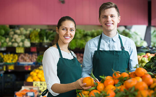 istock Stuff in apron selling sweet oranges, lemons and tangerines 585522042
