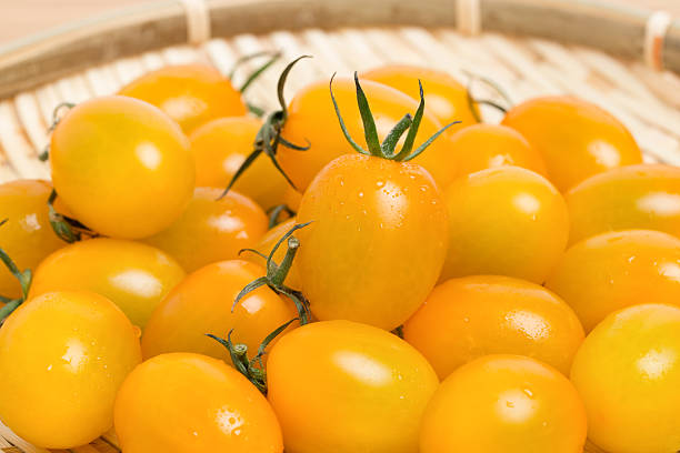 Yellow cherry tomatoes Yellow cherry tomatoes grape tomato stock pictures, royalty-free photos & images