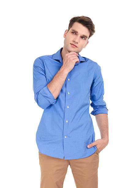 istock Thoughtful young man holding his hand to the chin 585523888