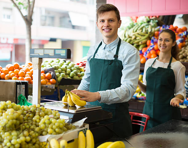 istock Sellers with bananas at market 585524146
