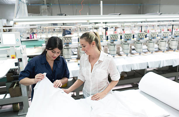 istock Women working at an embroidery factory 585525420