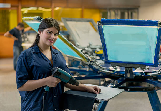 istock Woman textile printing at a factory 585525434