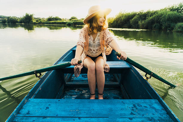 istock Young woman in the boat 585525530