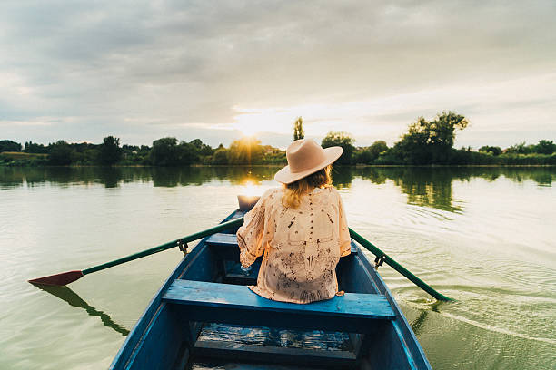 istock Young woman in the boat 585525566