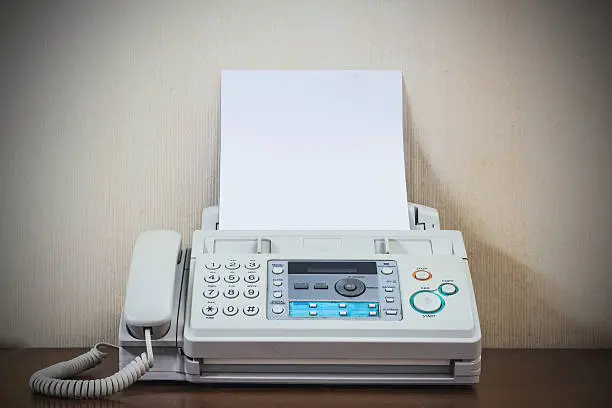 Photo of pushing start button old fax retro