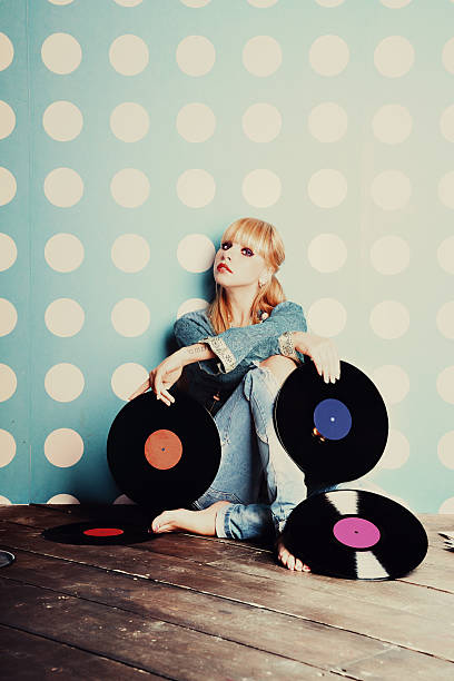 istock Young girl with vinyl records 585582378