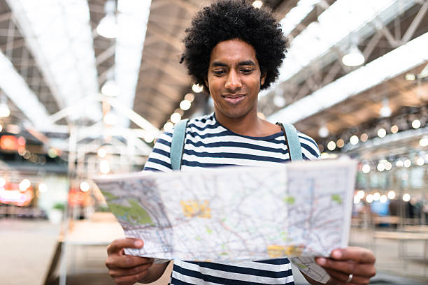 istock solo traveler in londonspitafields market reading a map 585582750