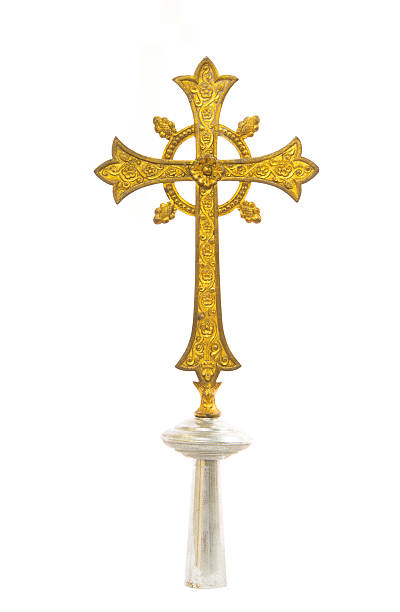 istock Antique gold cross on white background 585583690