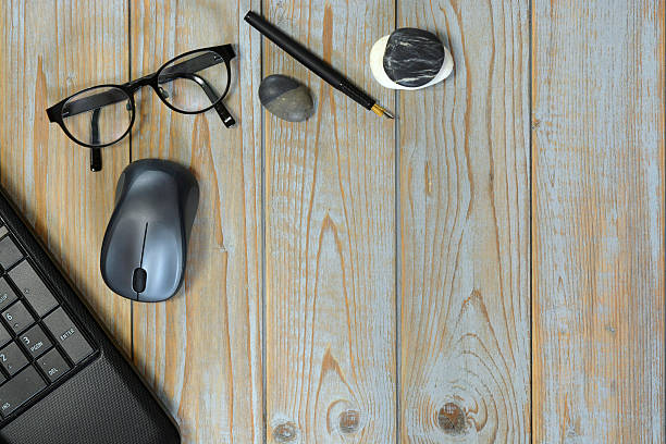 istock Wooden desk table with laptop computer in the office 585584786